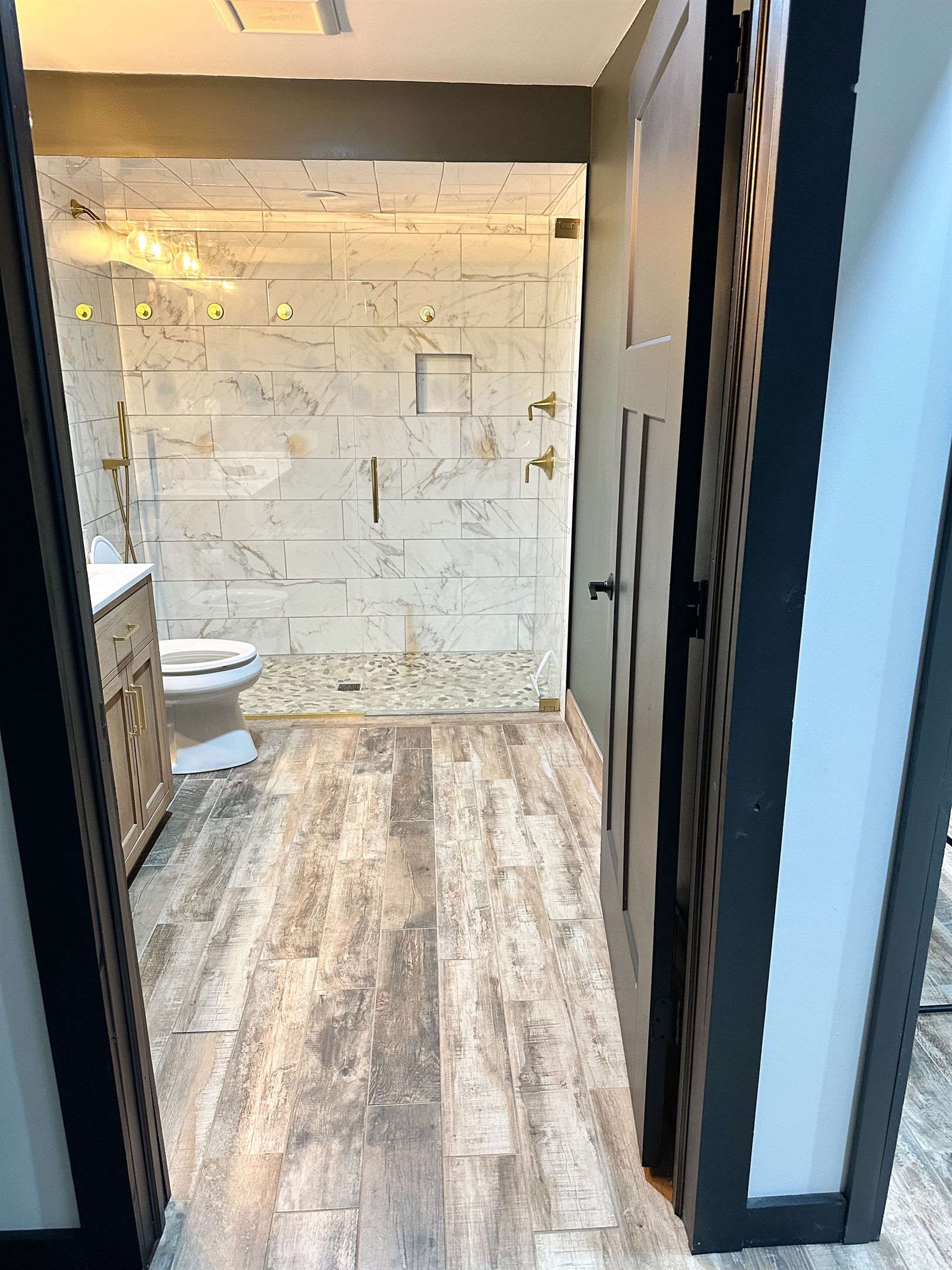 Our main bathroom features a doorway wider than 32 inches and a roll in shower for accessibility. 