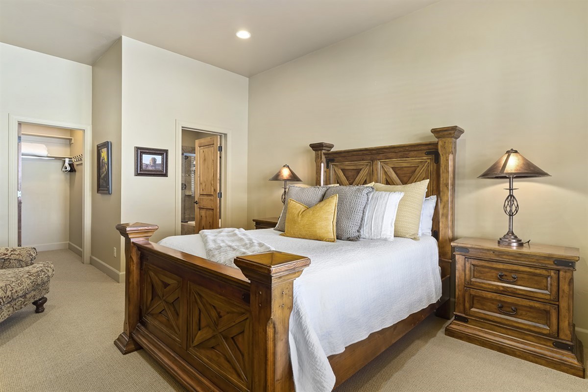 Well-appointed bedroom with warm tones and thoughtful details throughout.