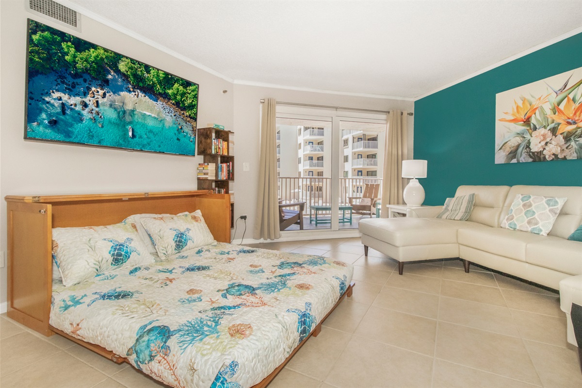 Huge open cozy living room with queen size Murphy bed.