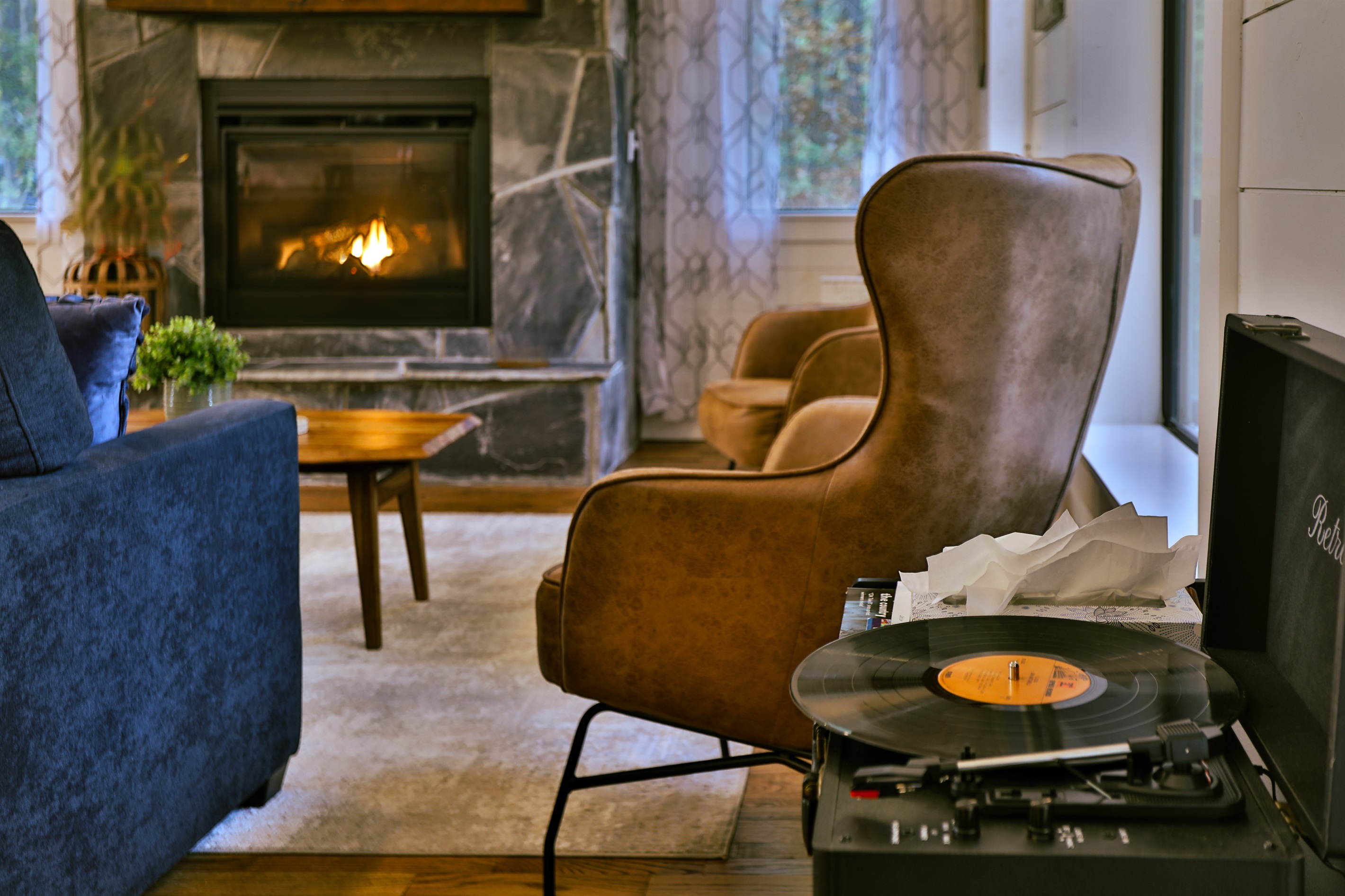 Cozy up by the fire in this stylish retreat. Spin your favorite vinyl as you sink into the warmth of a secluded cabin, surrounded by rustic charm and modern comfort. The perfect backdrop for an intimate and peaceful weekend escape.