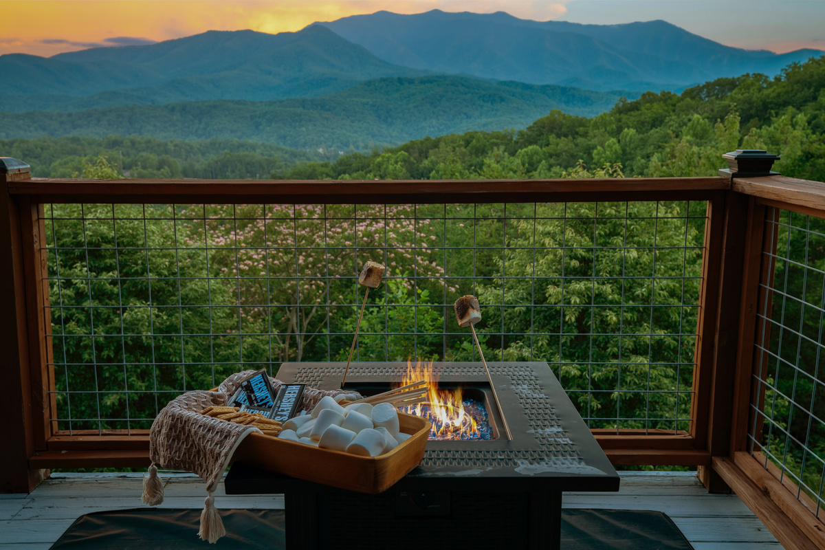 Fire pit on the main level deck overlooking the Smokies
