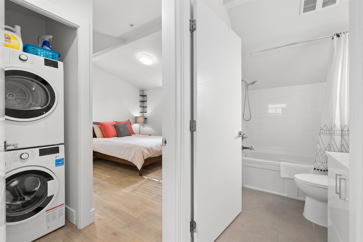 Upstairs: good sized bedroom with queen bed, full bathroom, laundry and a small storage area.