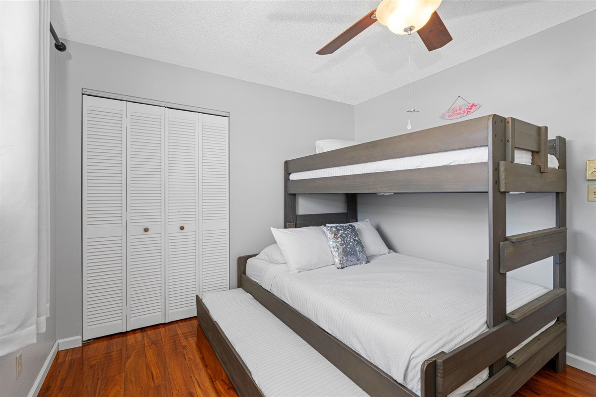 Relax in this thoughtfully furnished room featuring a bunk bed, modern furniture, and everything you need to feel right at home.