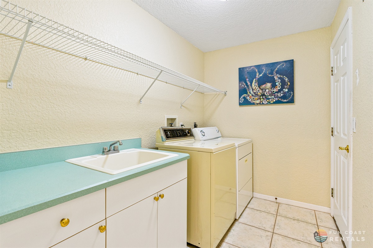 Laundry Room with Washer, Dryer, and Sink