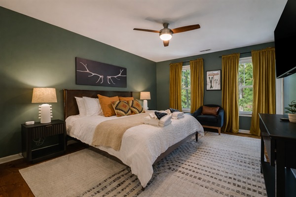 A warm and inviting primary suite — unwind with soft lighting and cozy textures.