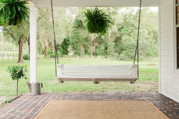 The porch swing - the best seat in the house for slow mornings. 