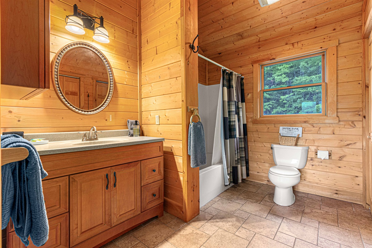Upstairs Bedroom 1 : Sunlit space with natural wood finishes and modern fixtures for a refreshing retreat!