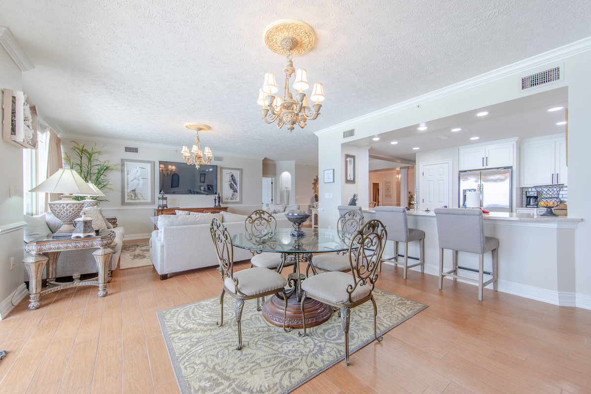 Breakfast Area Looking Into the Living Area with Commfortable Seating and a 70 Inch Smart TV