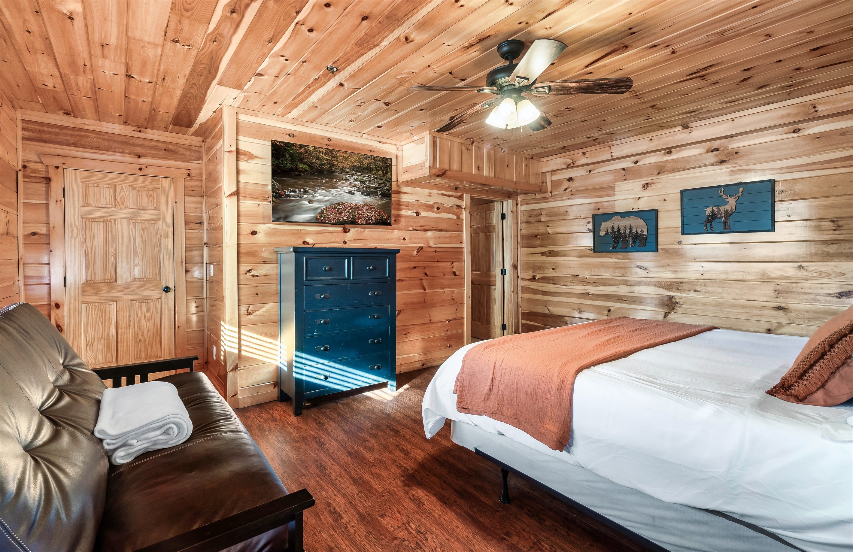 Stretch out in this welcoming queen bedroom with soft linens, a Smart TV, and extra space to unwind.
