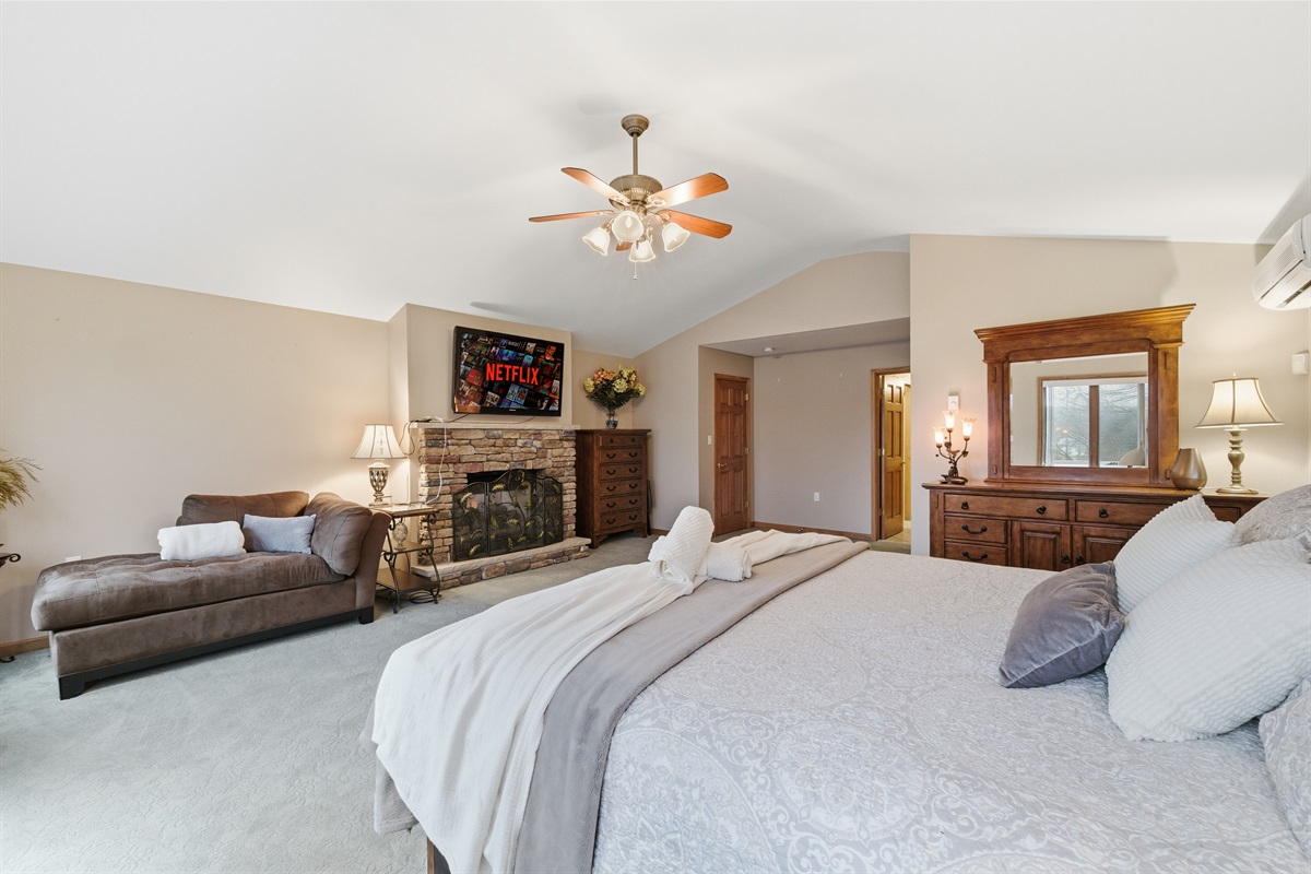 Master Bedroom with King size bed, fireplace, Roku TV and en-suite bathroom
