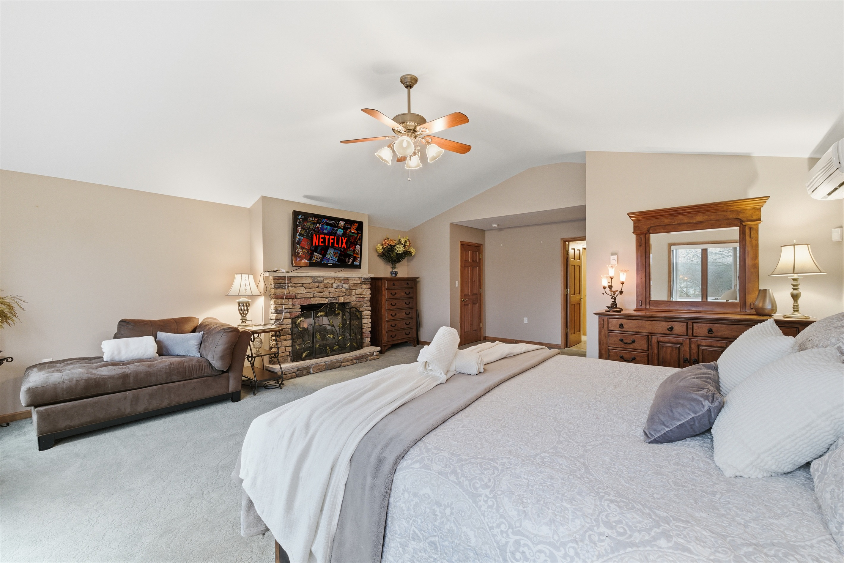 Master Bedroom with King size bed, fireplace, Roku TV and en-suite bathroom