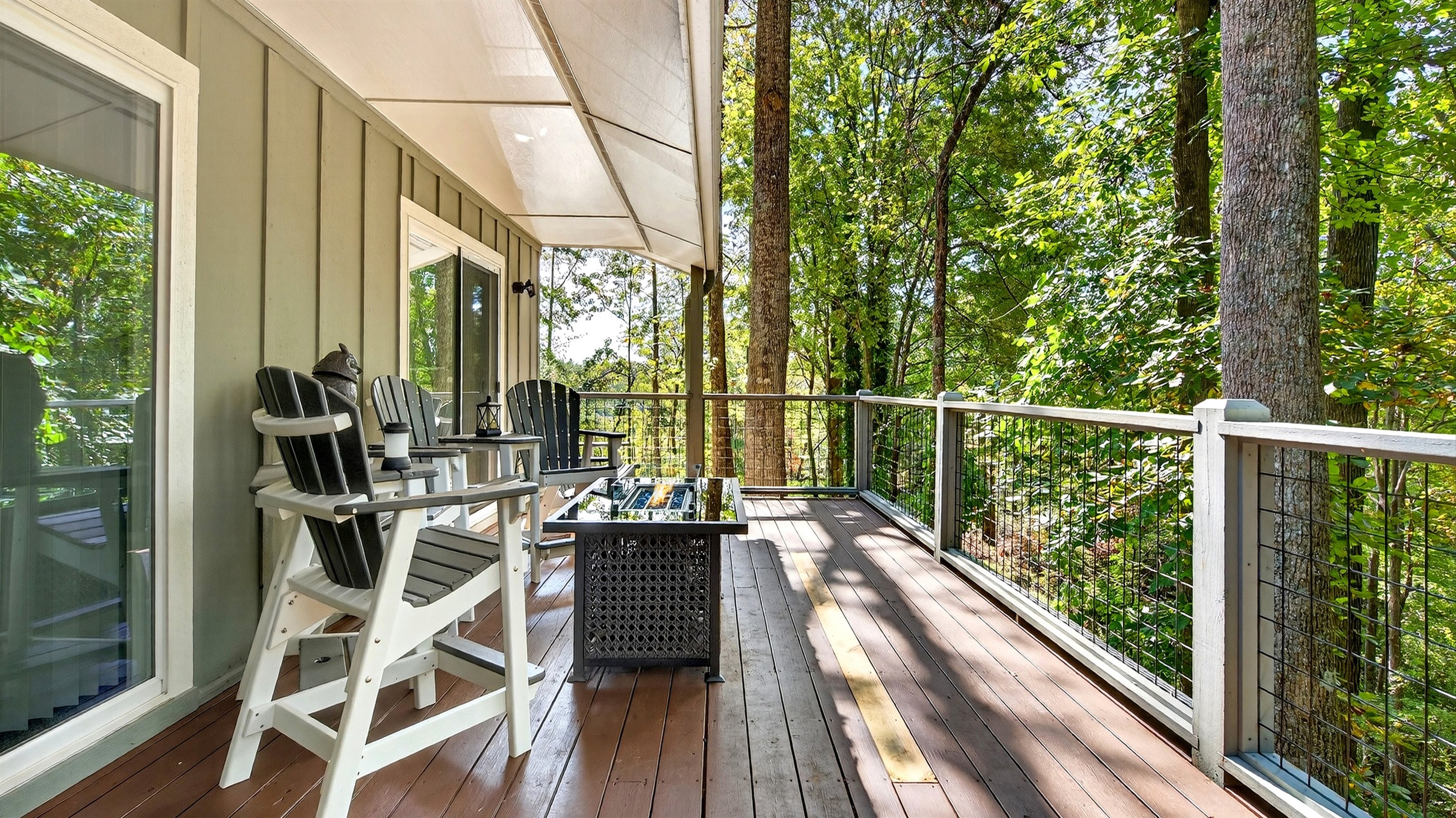 Outdoor seating by the fire table on the upper-level deck.