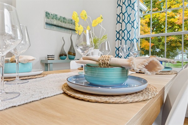 Set to impress—our South Bend guest retreat dining room offers beautiful, colorful dishes for a fancy dinner, plus plastic options for kids or alfresco meals. Style meets practicality near Not