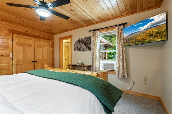 This roomy king bedroom comes with a TV, so you can lounge and stream in total comfort