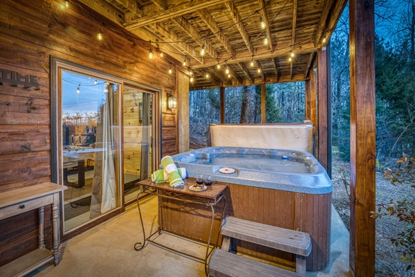 Hot tub looking out over back yard with orchard trees (seasonal fruit), firepit, woods with hiking paths, and mountain views!