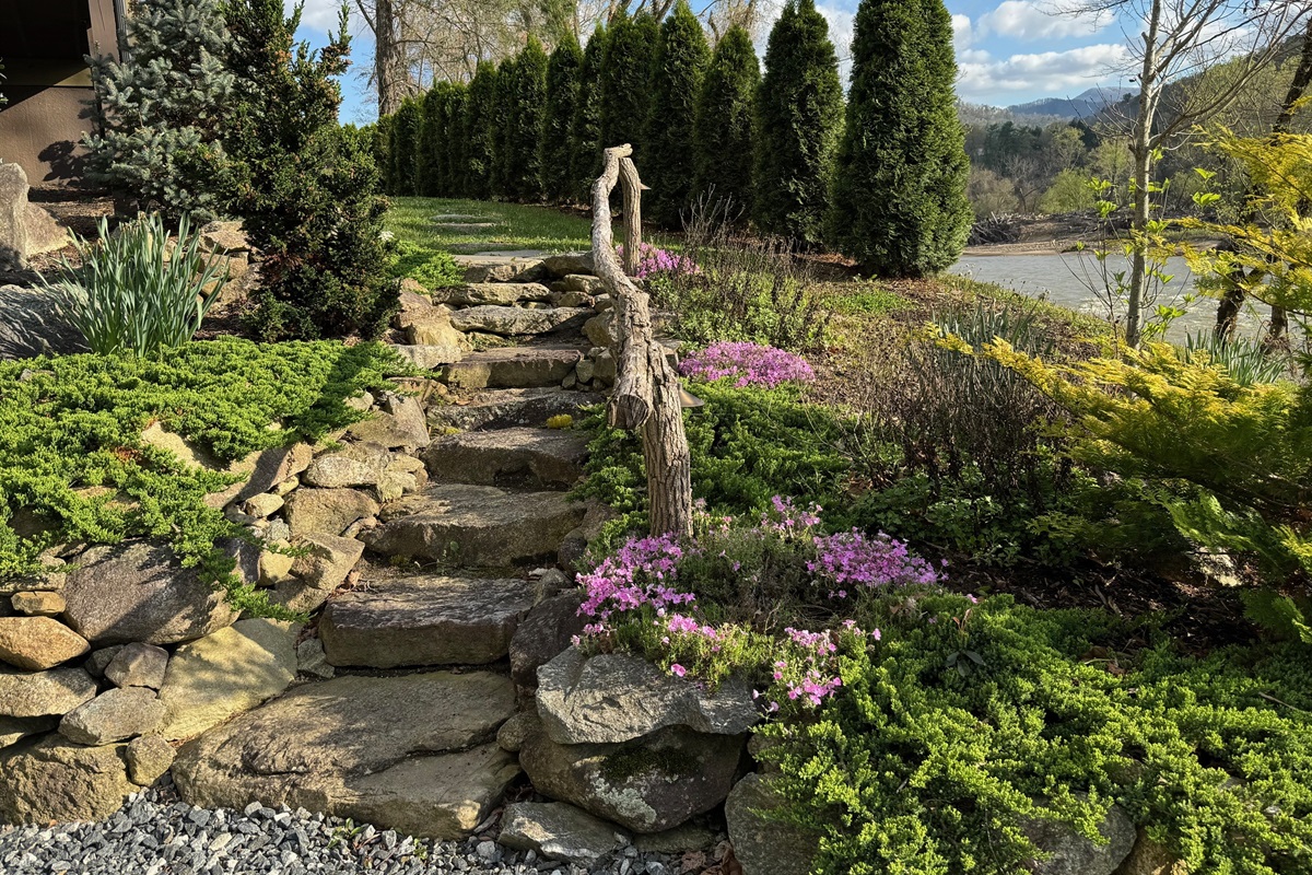 Stone steps from the parking area that lead to the main entrance
