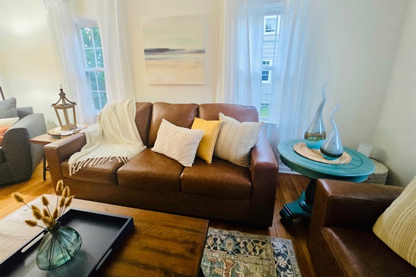 Natural light, layered warmth, and timeless hardwoods—welcome home.