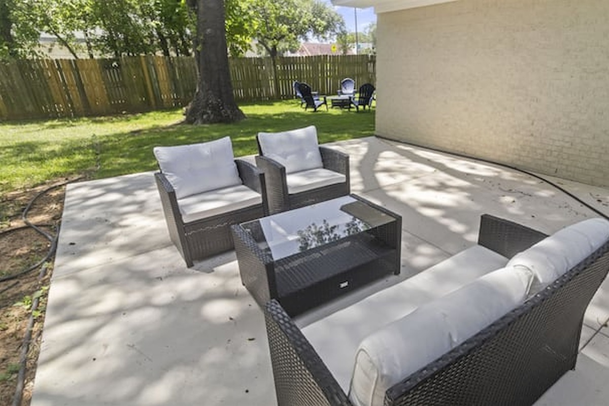 Private outdoor patio with comfortable seating and plenty of space to unwind outdoors.