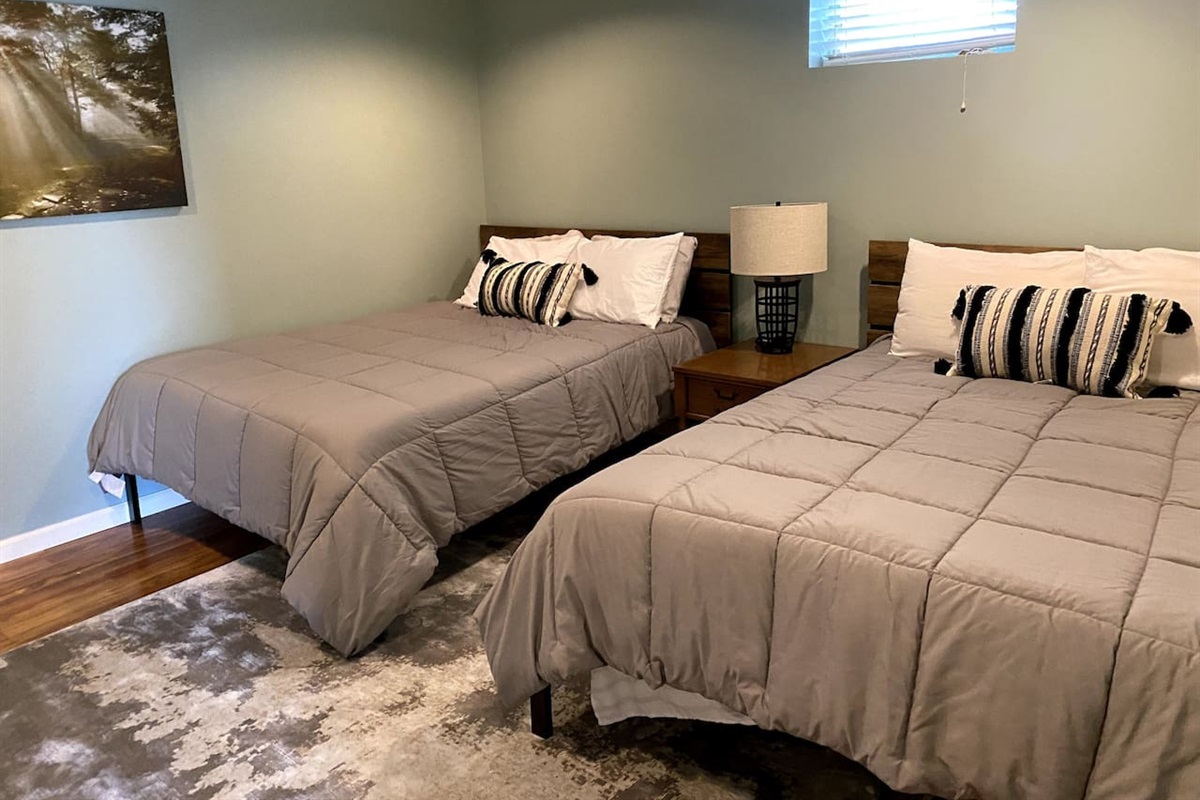 Wake up to views and fresh air—2 queen beds and a walk-out right from your room 