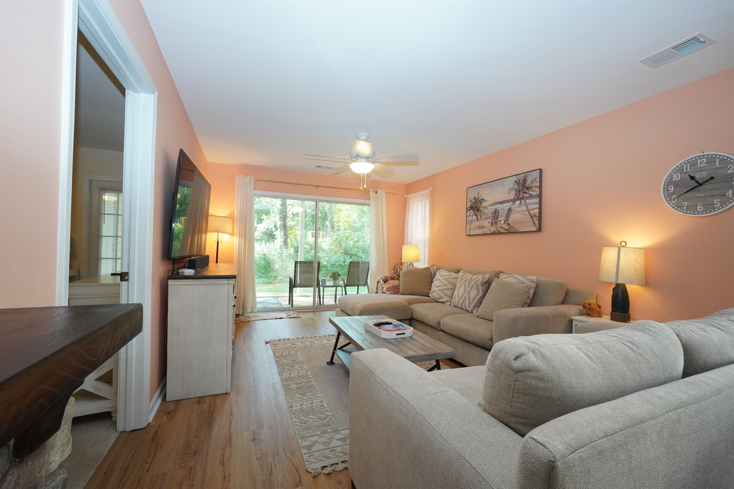 Spacious Living Space with Screened-In Porch Access