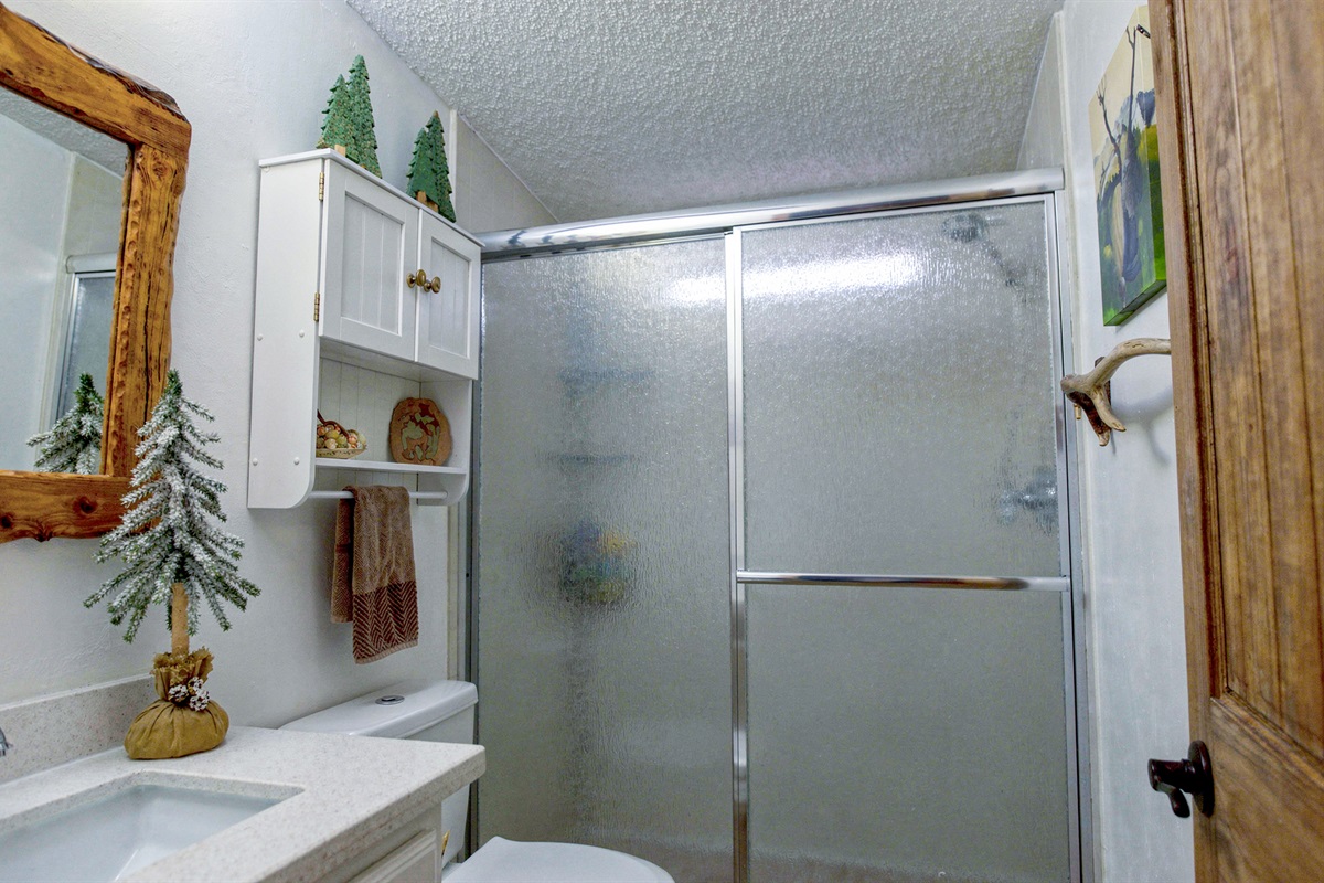 Clean, bright cabin bathroom designed for comfort and ease.