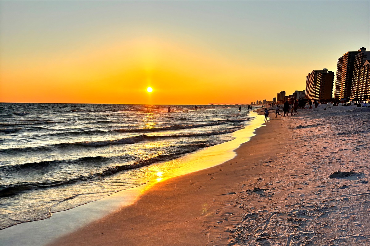 An evening stroll on Panama City Beach's sugar white sands is a must to experience its million-dollar sunsets