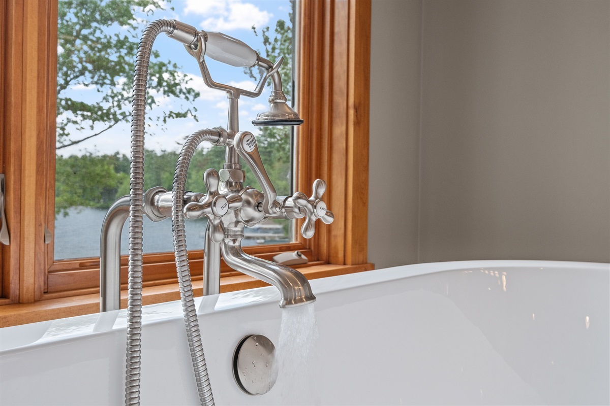 Second floor master bathroom with Lake Winnipesaukee views soaking, tub and walk in shower