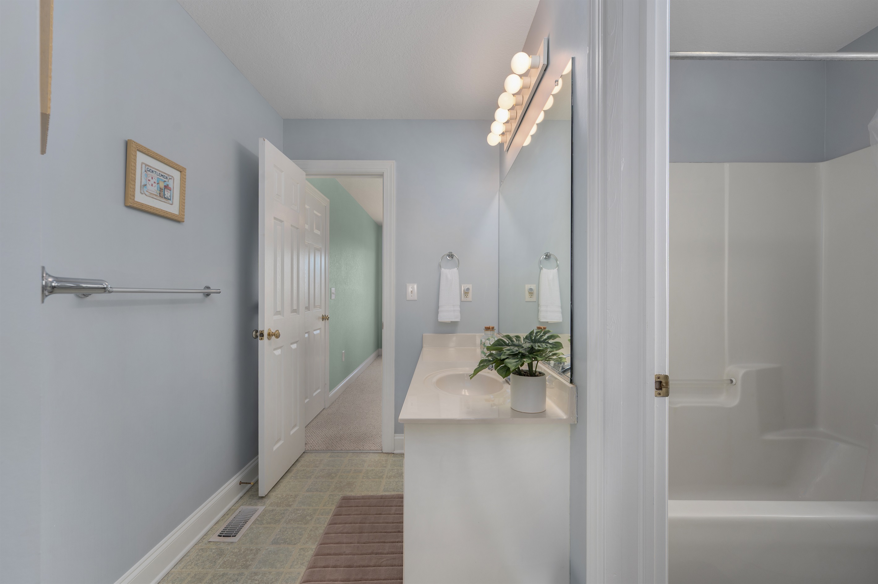 Spacious Jack-and-Jill bathroom with double sinks.