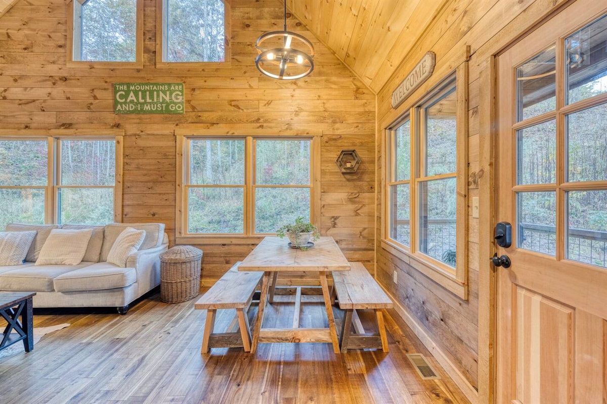  Our compact dining table comfortably accommodates four, perfect for cozy meals and lively conversations in a space designed for togetherness.