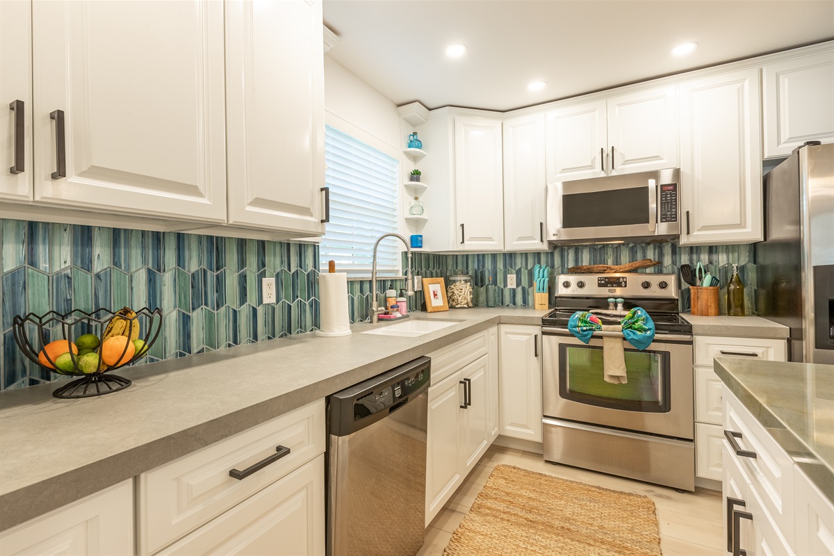 Kitchen Oasis: Bright, airy space with vibrant tiles, modern appliances, and a cheerful vibe!