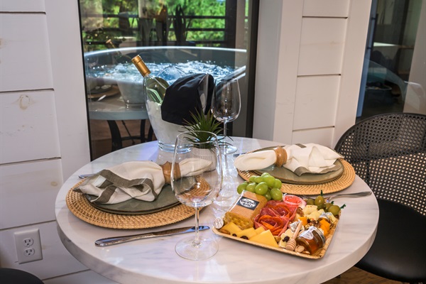 Toast to slow moments — share a bottle of wine, a charcuterie board, and laughter before slipping into the hot tub under the trees.