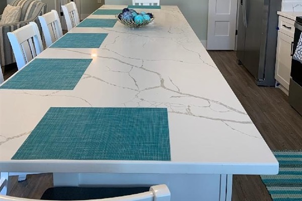 Oversized center island includes power outlets with USB charging ports. 