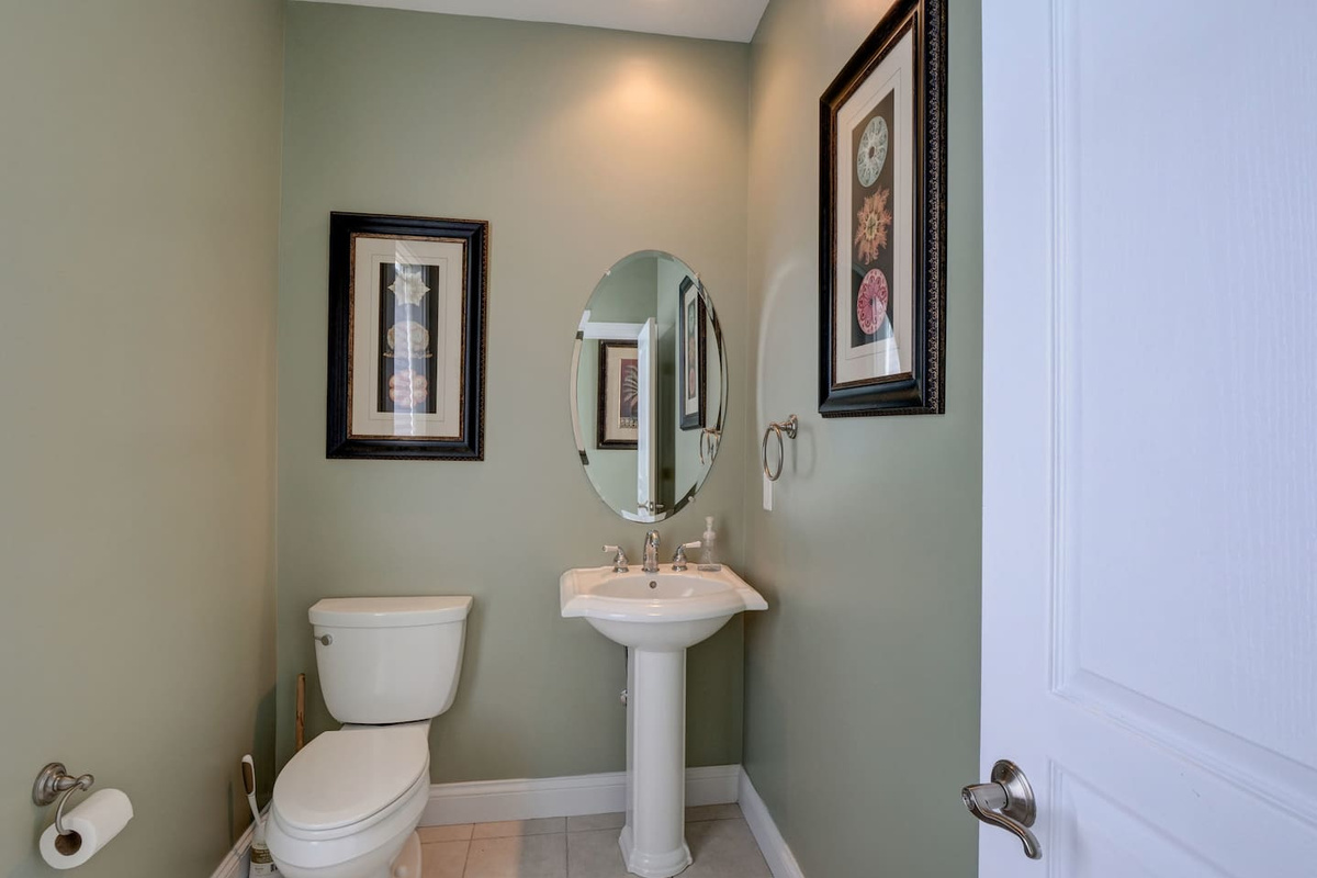 This half bath is located on the third level by the kitchen