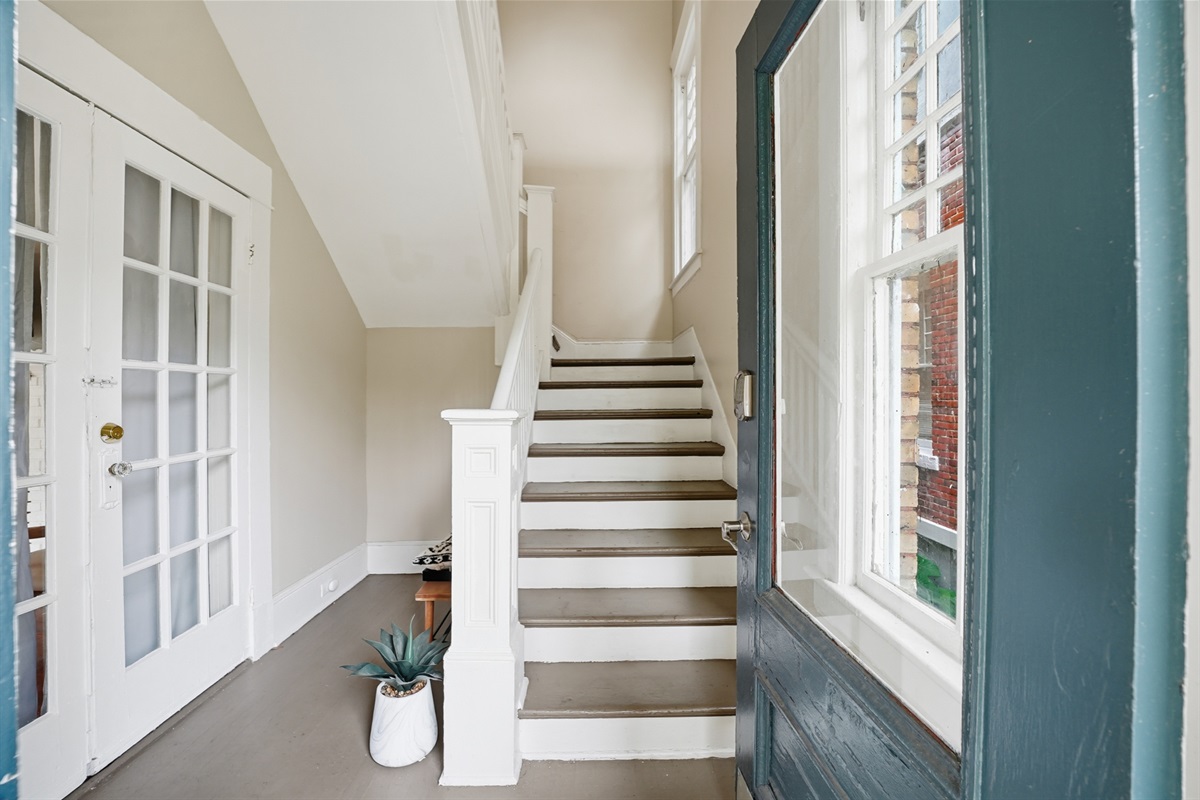 Entrance of the unit with stairs leading to the upstairs unit