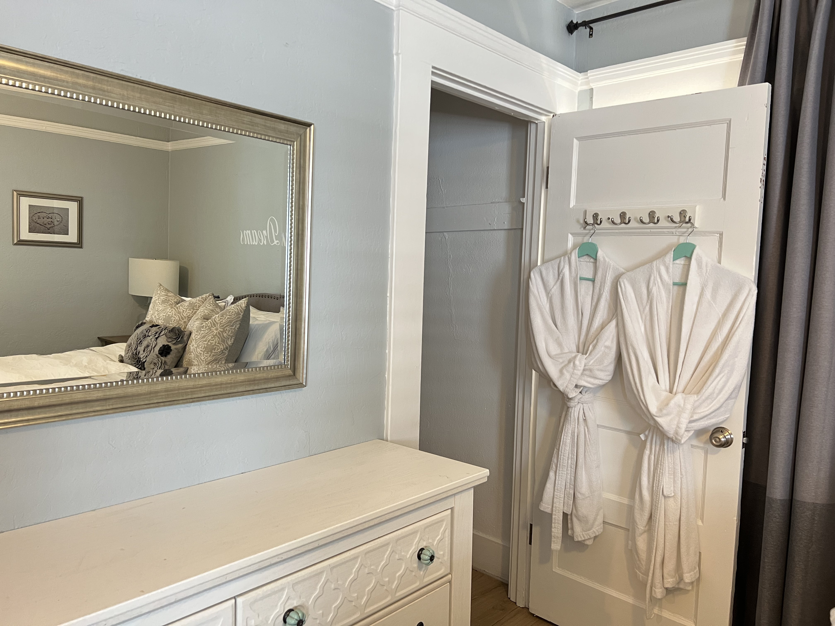 Walkin Closet with bathrobes and ample storage
