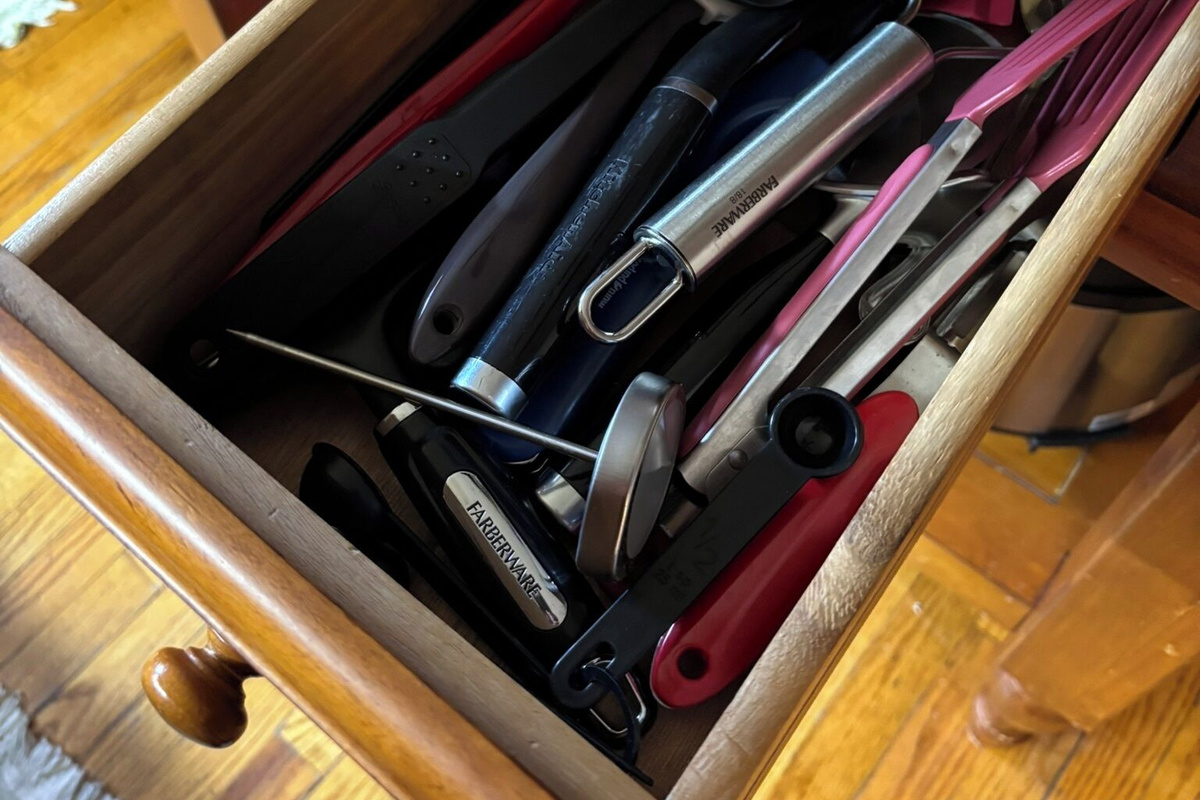 Lots of utensils to choose located in the kitchen island.
