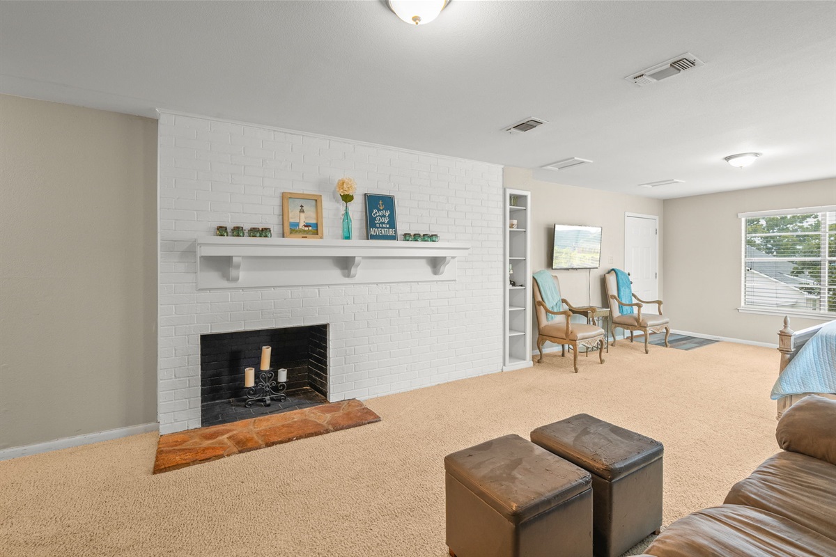 Expansive master bedroom on main floor. (Fireplace not for use)