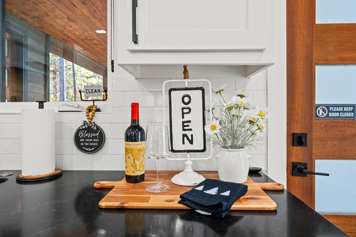 Subtle décor throughout the kitchen brings warmth and personality without overwhelming the clean design.