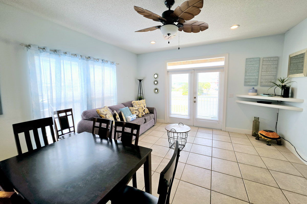 Living room with sofa and French doors to the balcony