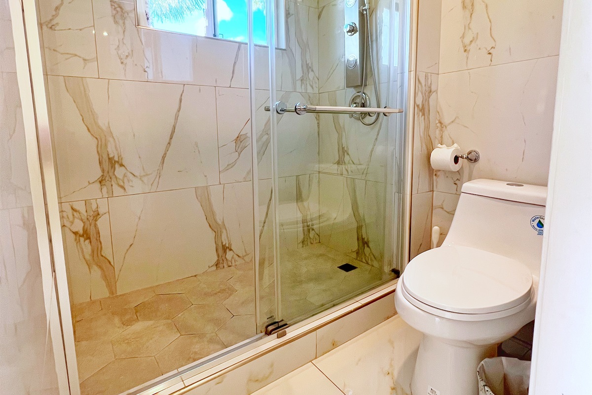 Shower with modern glass enclosure for a touch of luxury.