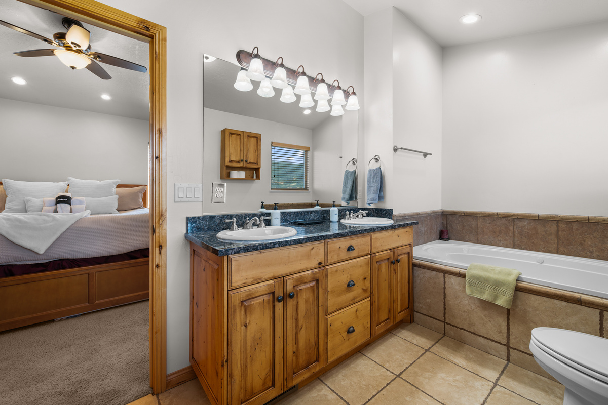 Bright Ensuite Bathroom with double vanities