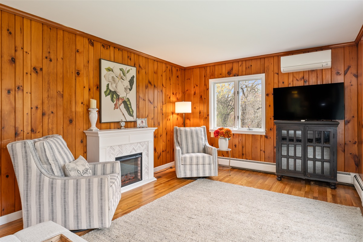 Spacious living room with electric fire place