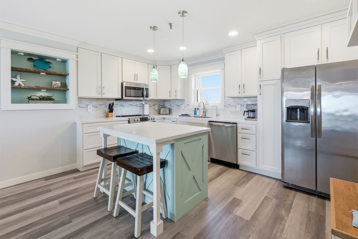 Bright coastal kitchen with updated appliances