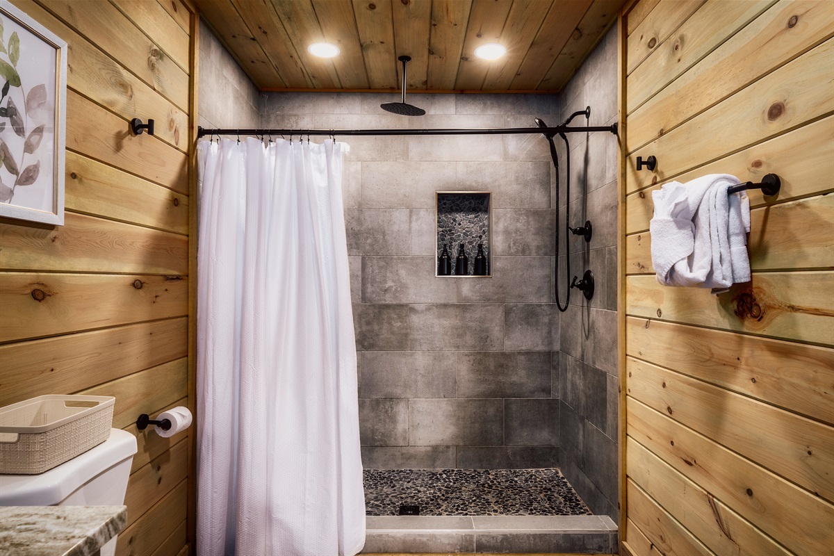 Spacious shower detail. Bright, spotless, and hotel-level clean.
