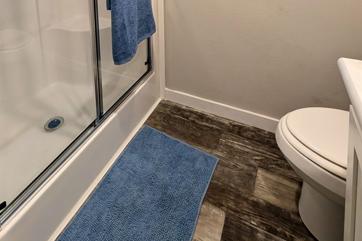 Bathroom offers a roomy shower.