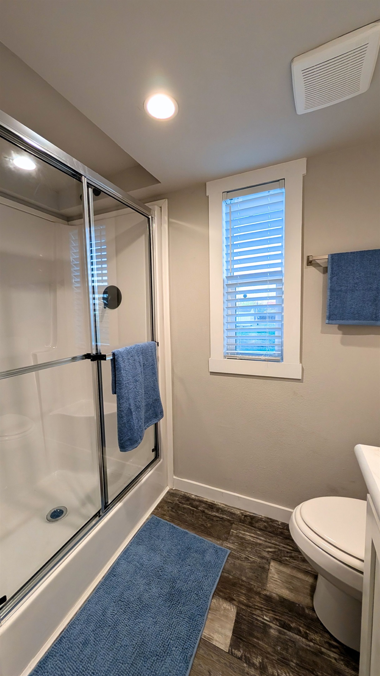 Bathroom offers a roomy shower.
