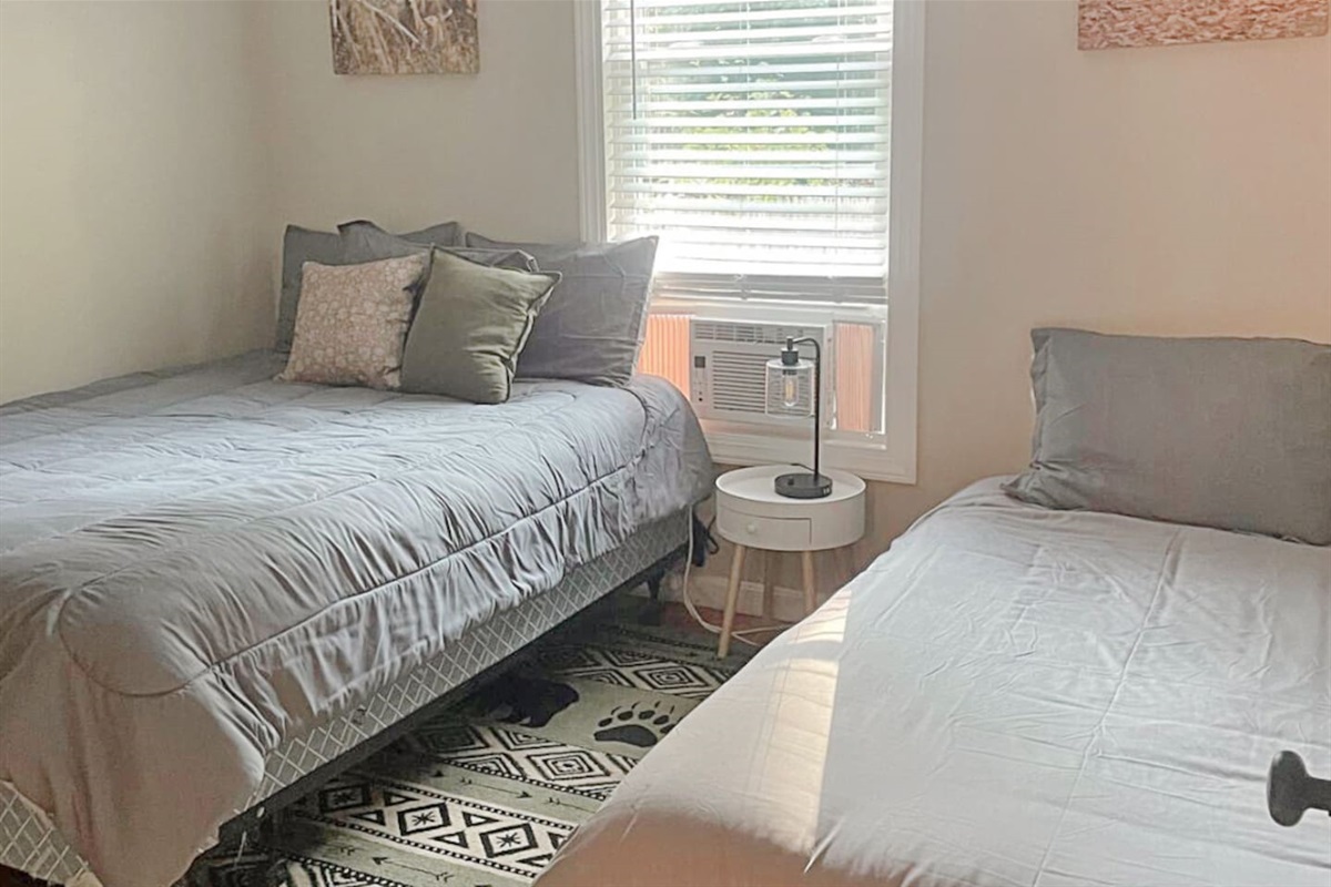 Bedroom 2 has 1 double bed and 1 twin bed