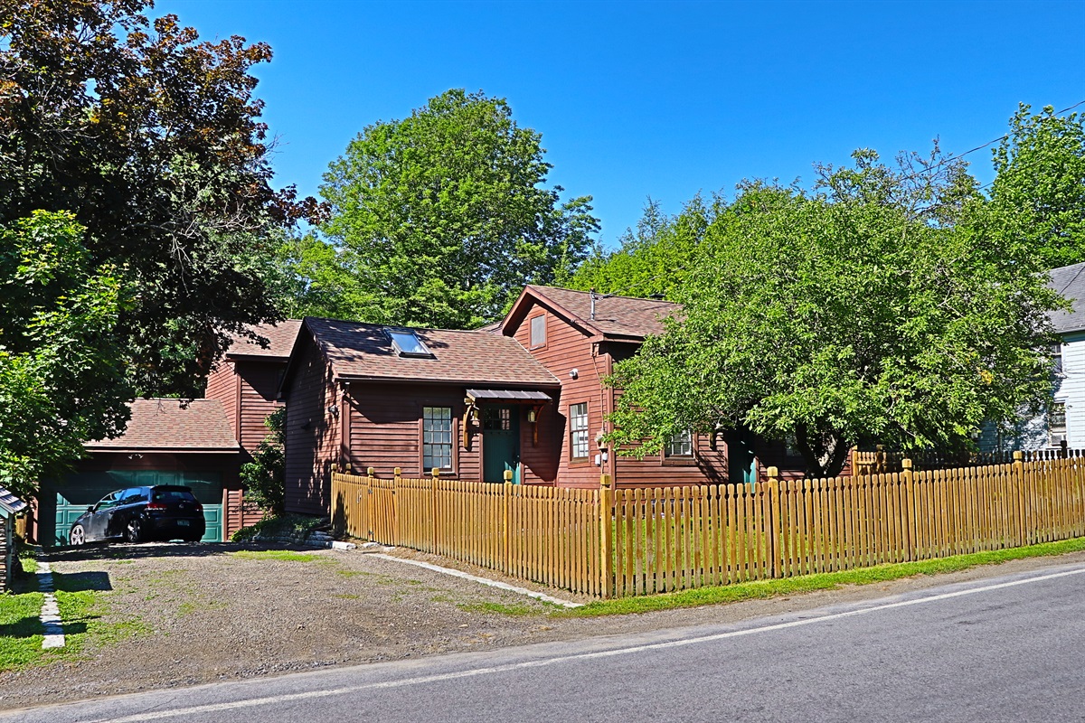 Craftsman House exterior, parking to the left.