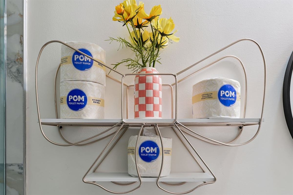 Full bathroom thoughtfully stocked with essentials including body wash, shampoo, conditioner, cotton pads, and Q-tips everything you need for a comfortable and refreshing stay.