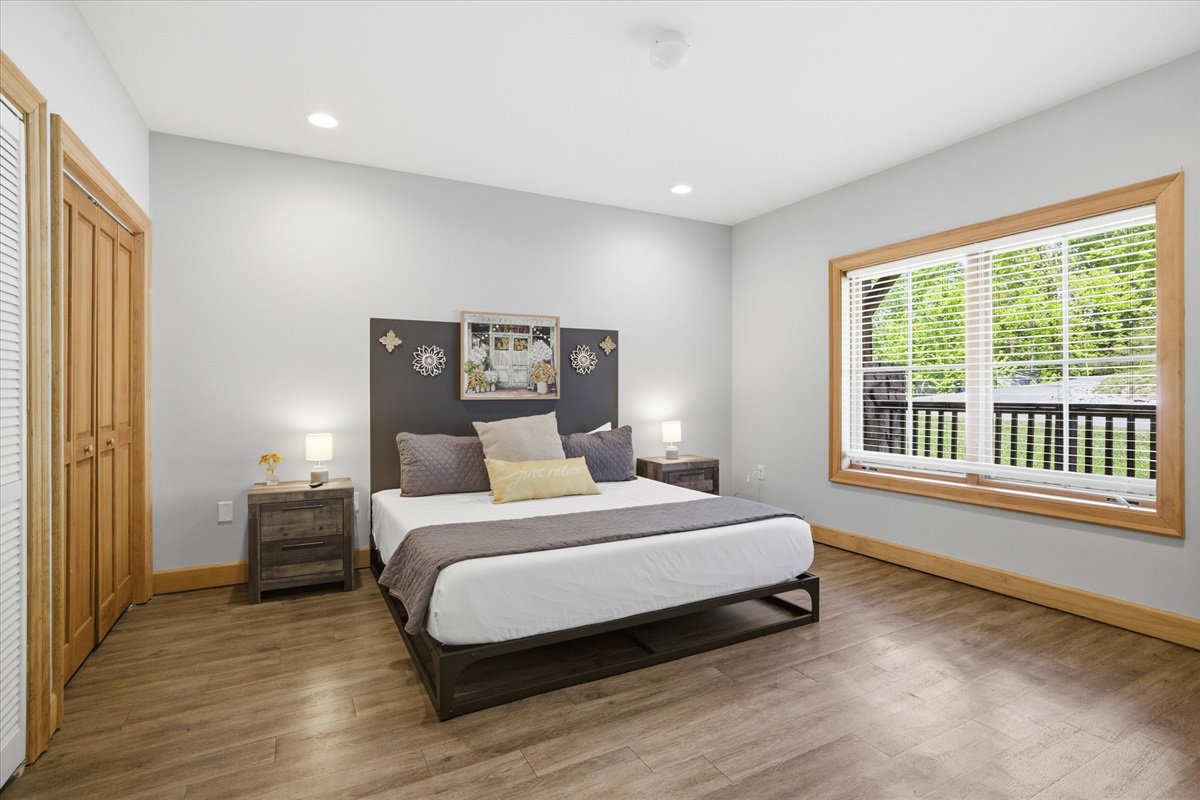 Unwind in the intentional, cozy first king suite, a calm and comfortable space designed for rest, with plenty of room to settle in and recharge.